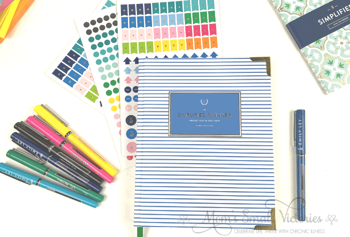 Weekly Simplified Planner Review. This amazing planner will help you simplify your life and schedule so you can make more time for the things that are truly important to you. Pictured here with accessories from Emily Ley: the Happy Stripe Pilot Precise v5 pen set, the color coding stickers, the variety sticker set and the mint tile mini notebook.